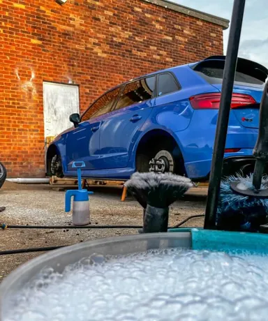 Bucket full of cleaning solution ready to clean dirty alloy wheels