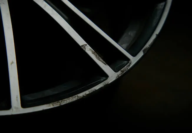 A damaged diamond cut alloy wheel before refurbishment