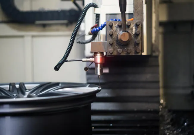 An alloy wheel on the alloy wheel lathe at Rolling Rims workshop