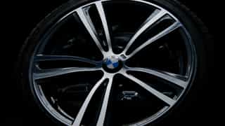 Refurnished BMW alloy wheel in gun metal gray with a diamond cut finish