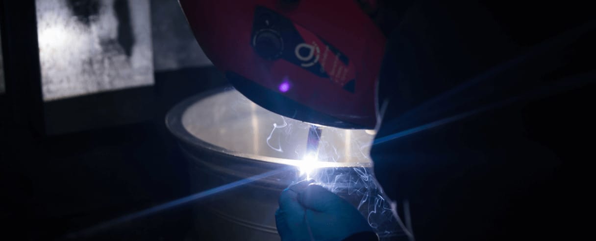 alloy wheel being welded by rolling rims