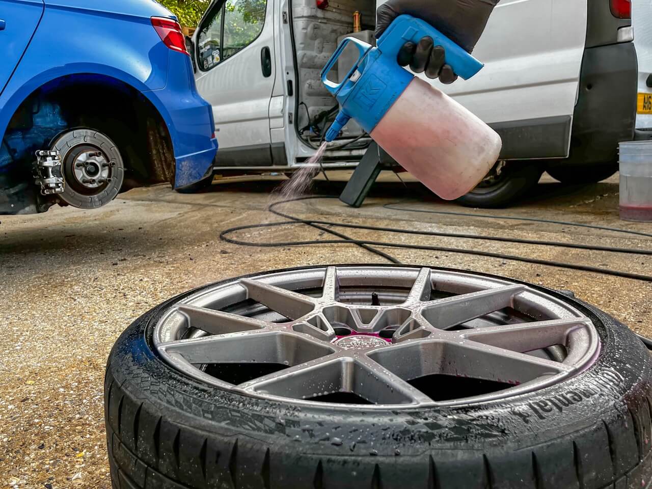 Applying the cleaning solution to the dirty alloy wheel