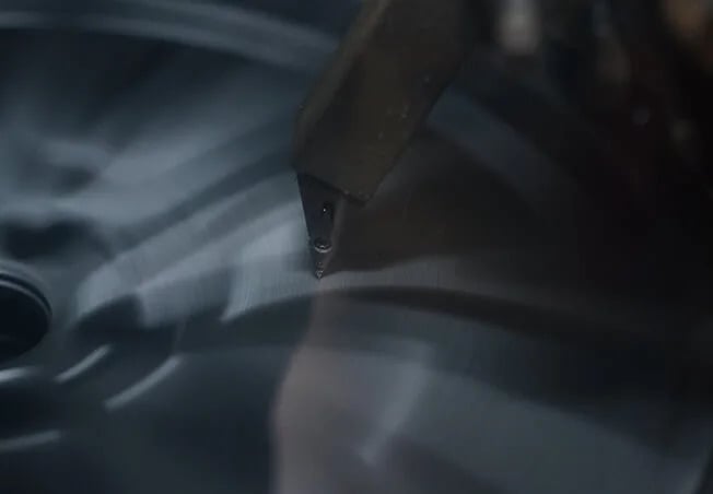 Diamond cut alloy wheel on the lathe at Rolling Rims