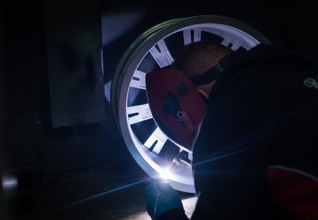 Cracked alloy wheel being repaired by welding at Rolling Rims