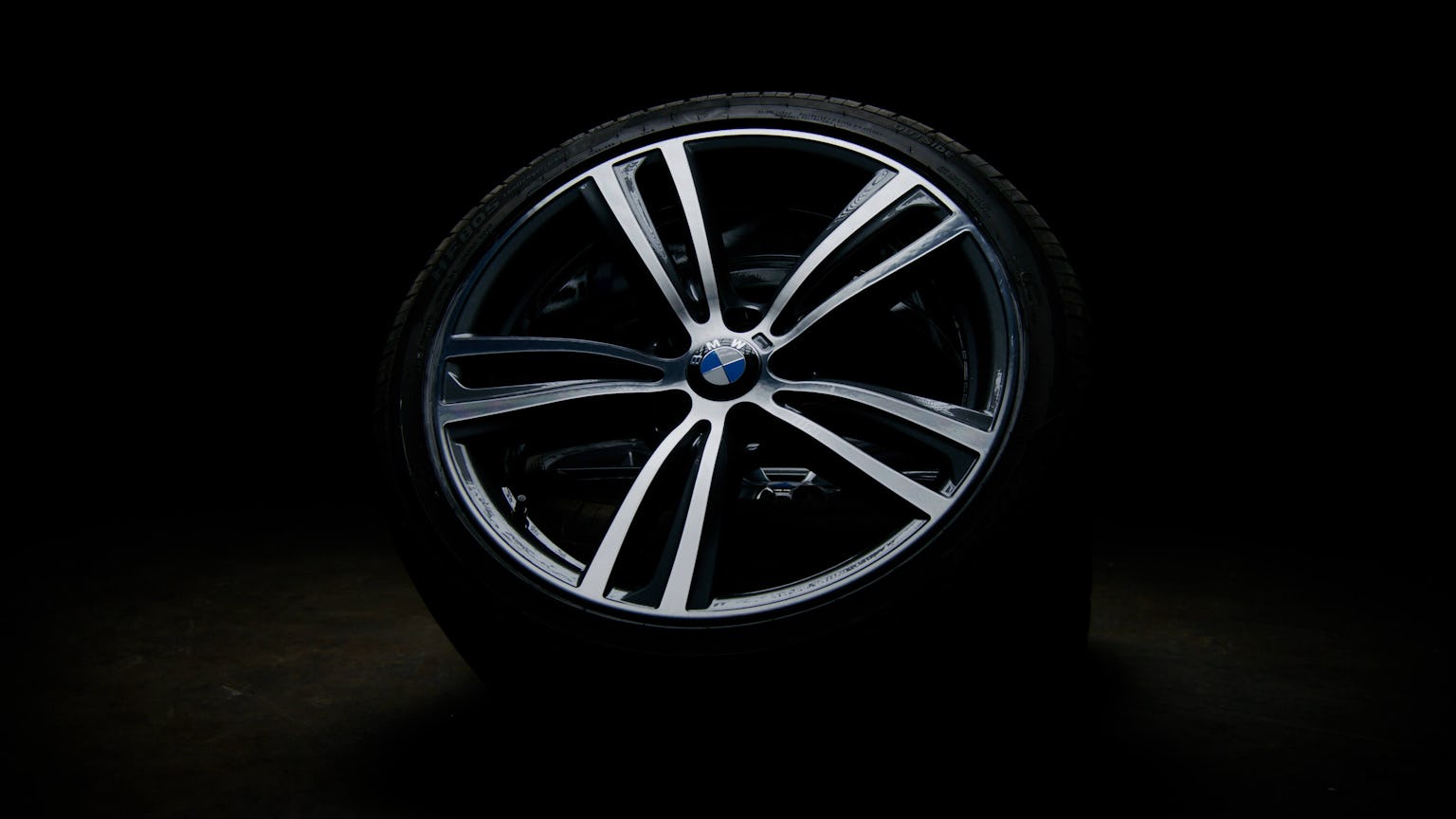 Refurnished BMW alloy wheel in gun metal gray with a diamond cut finish