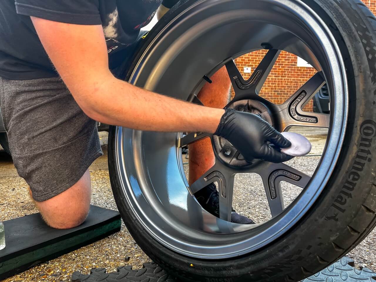 Applying ceramic coating to the inside of the alloy wheel with an applicator pad
